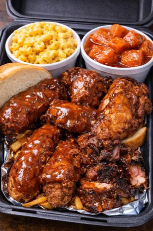 Sauced wings, rib tips, mac and cheese, and yams